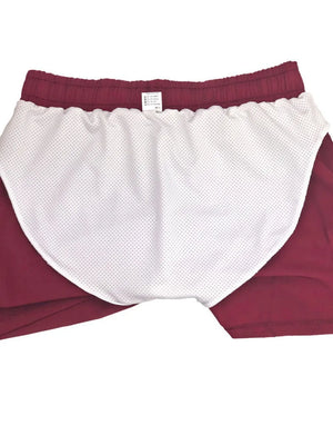 Coastal swim shorts in deep red with built-in white mesh liner and elastic waistband.