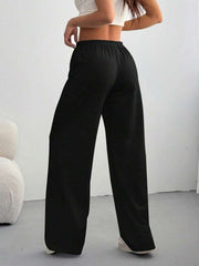 Black casual wide-leg maternity pants with drawstring waist, shown from the back.