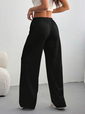 Black casual wide-leg maternity pants with drawstring waist, shown from the back.