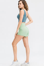 Light Green high-waist active shorts with a sculpted fit and smooth finish.