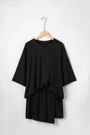 Black tie-wrap two-piece ensemble with asymmetric hem and drawstring detail