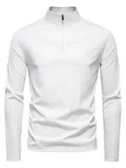 White performance zip-neck tee with structured shoulders and long sleeves.