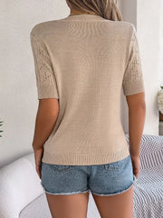 Tan openwork knit t-shirt with short sleeves and a crew neck, styled with denim shorts.