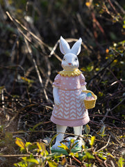 Blush pink Easter bunny ornament in a polka dot dress holding a basket of eggs.