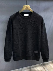 Black crewneck sweatshirt with embossed geometric texture and ribbed cuffs and hem.
