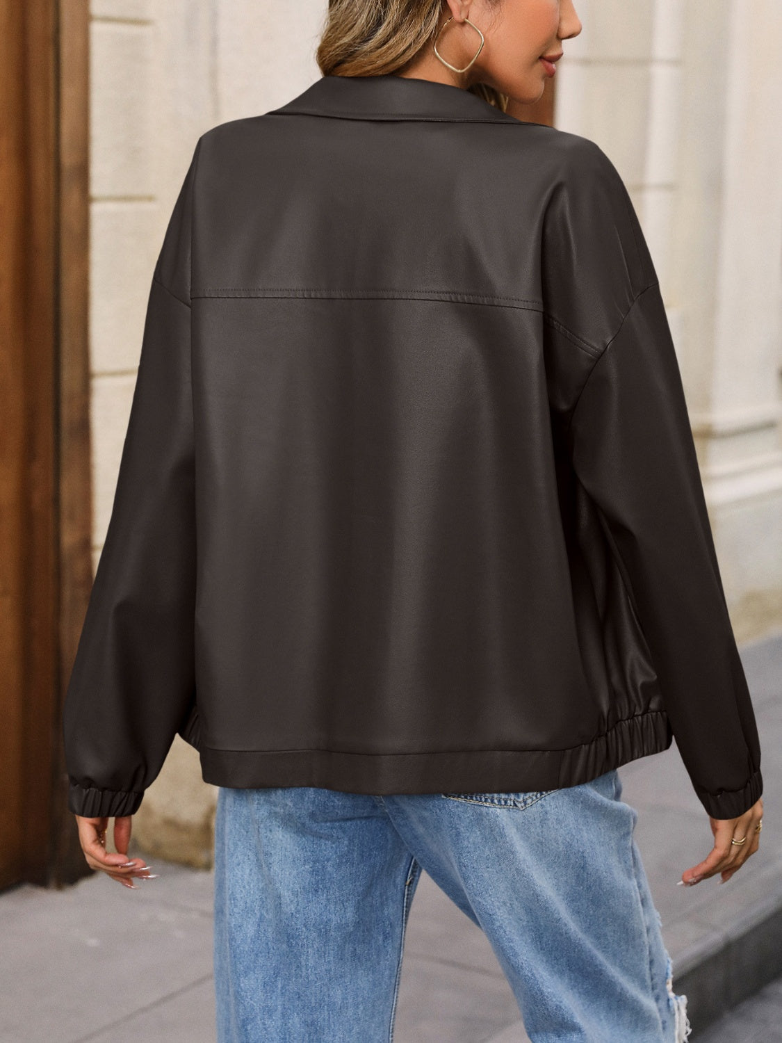 Earthy faux leather bomber jacket in black with a relaxed fit and elasticated cuffs and hem.