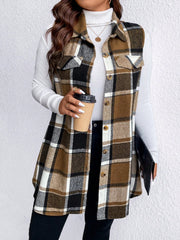 Oversized plaid shirt vest in brown, black, and white with button front and chest pockets.