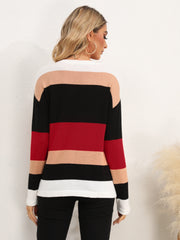 Colorblock crewneck sweater with horizontal stripes in black, red, tan, and white.