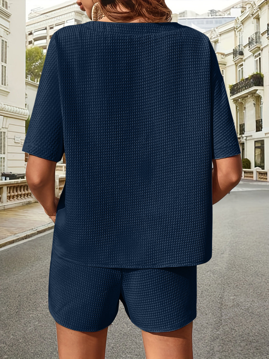 Dark blue waffle knit drawstring co-ord set with short sleeves and shorts.