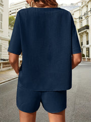 Dark blue waffle knit drawstring co-ord set with short sleeves and shorts.