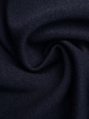 Navy knit vest fabric detail with subtle texture.