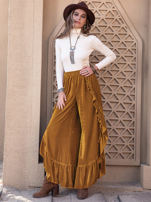 Velvet ruffle slit palazzo pants in caramel with ruffled hems and sides.