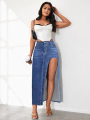 Light blue denim maxi skirt with a high slit, styled with a white corset top.