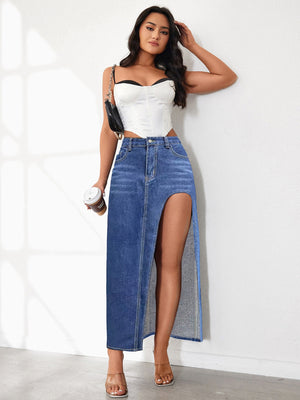 Light blue denim maxi skirt with a high slit, styled with a white corset top.