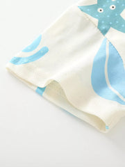 Baby t-shirt with playful blue ocean creature graphic on cream cotton, short sleeves.