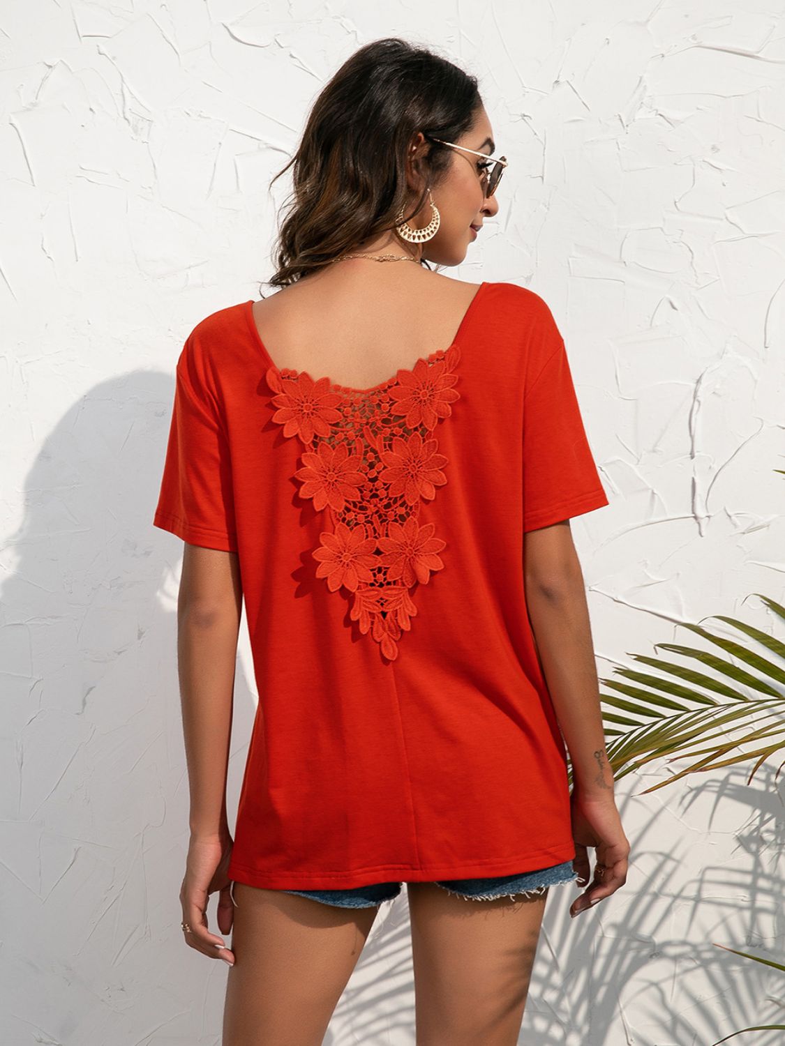 Red orange t-shirt with floral lace detail on the back