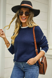 Dark blue acrylic crewneck sweater with contrast white trim on neckline and cuffs.