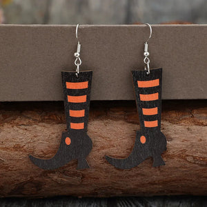 Black witch boot silhouette drop earrings with orange stripes and hook backs.
