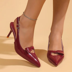Burgundy patent slingback pumps with bow detail and ankle strap.