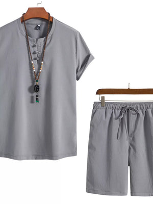 Grey men's casual set with mandarin collar shirt and drawstring shorts.