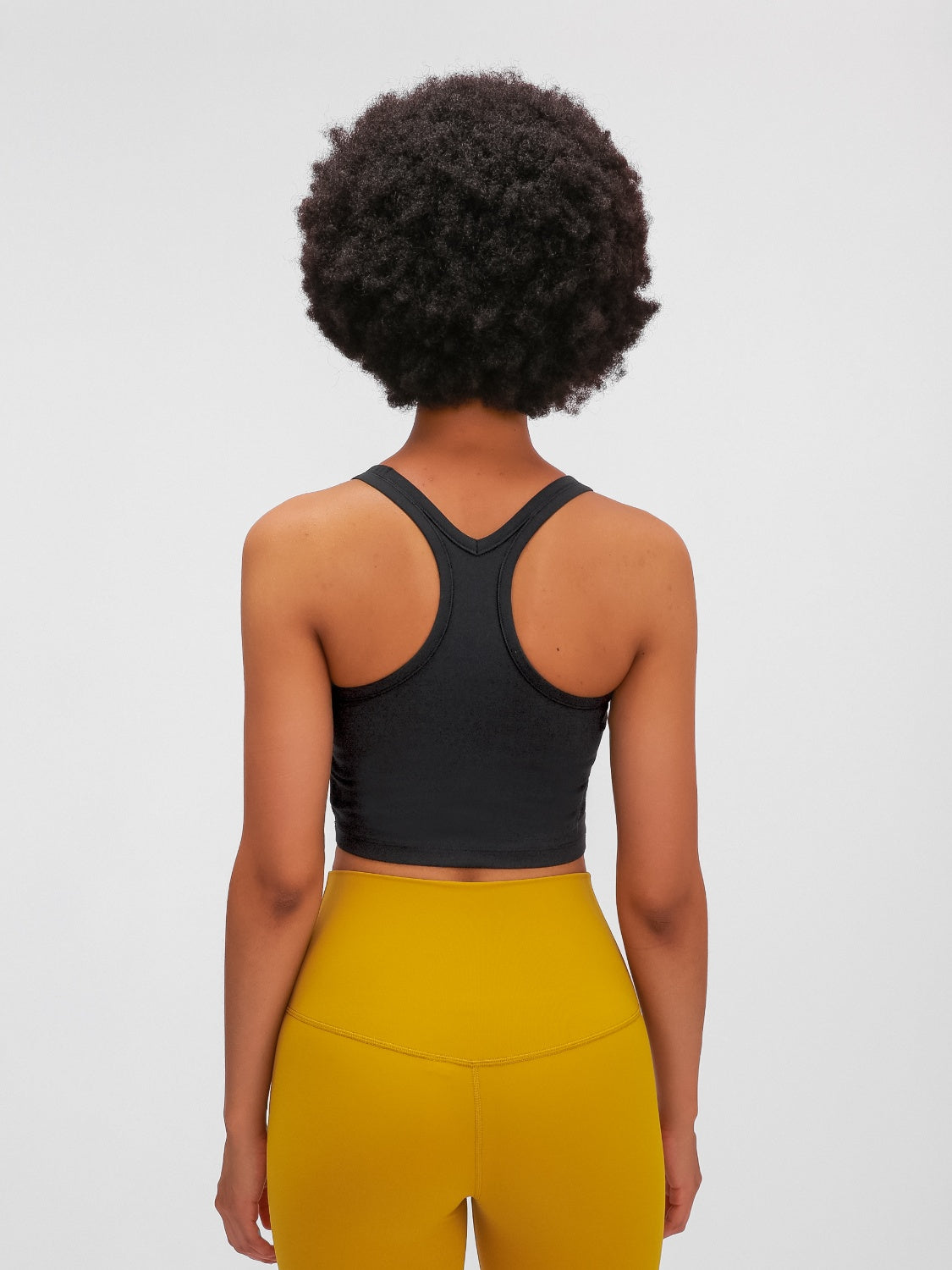 Black racerback crop tank top with a textured fabric detail.