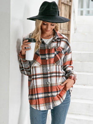 Oversized plaid shacket with patch pockets in orange, white, and black.