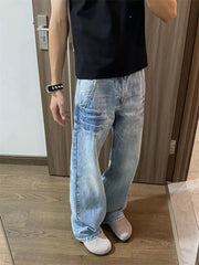 Men's light wash vintage wide-leg jeans with distressed details.