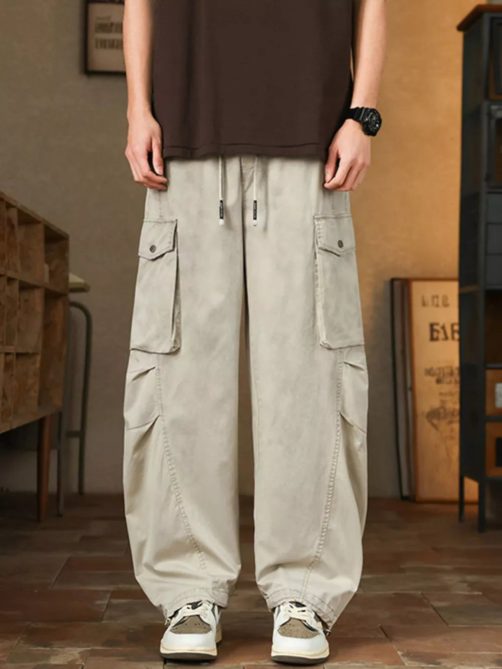 Men's Paris Gray drawstring cargo pants with button-down flap pockets and adjustable waist.