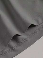 Sleeveless grey midi dress with detailed stitching on hem and neckline.