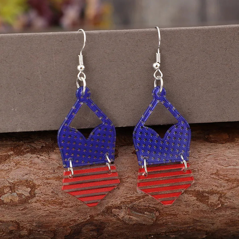 Patriotic bikini acrylic drop earrings in dark blue with stars and red striped bottoms.