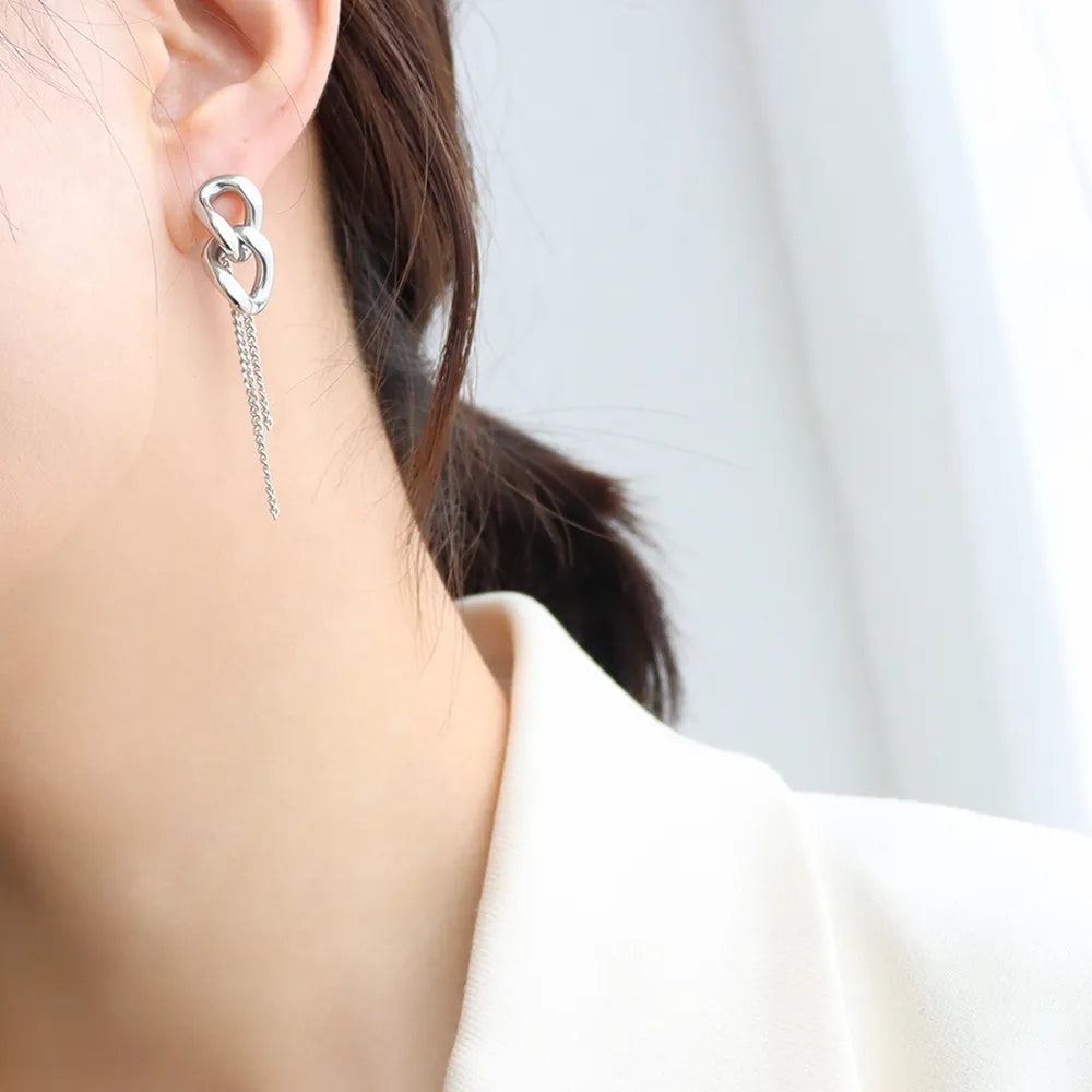 Silver linked chain drop earrings with delicate chain fringe detail.