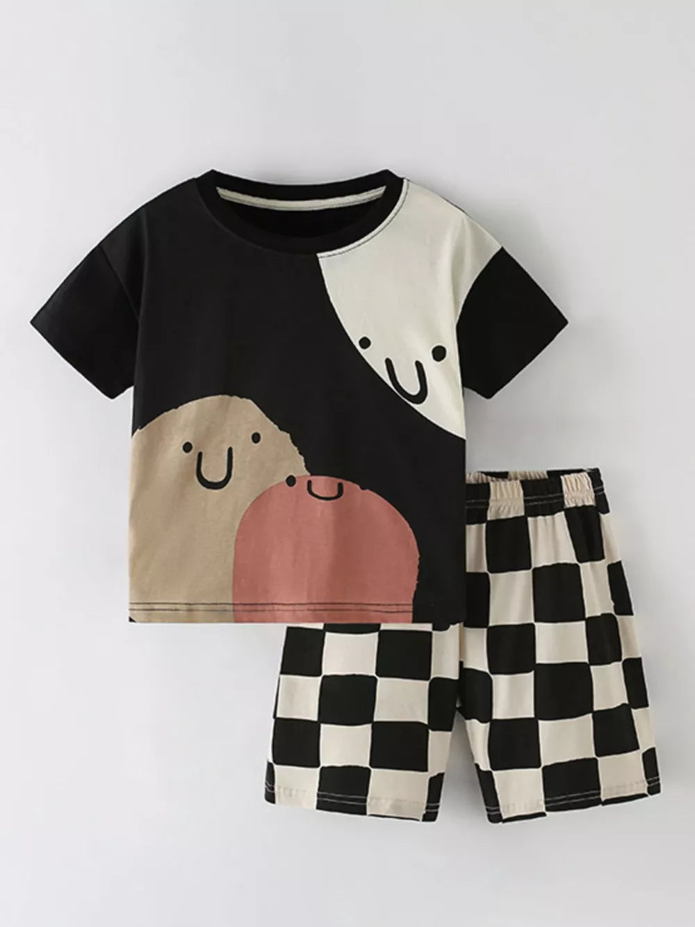 Toddler color-block cotton set with checkerboard shorts and graphic tee.