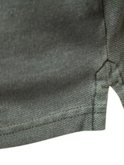 Textured polo shirt in dark gray with side vents and reinforced stitching.