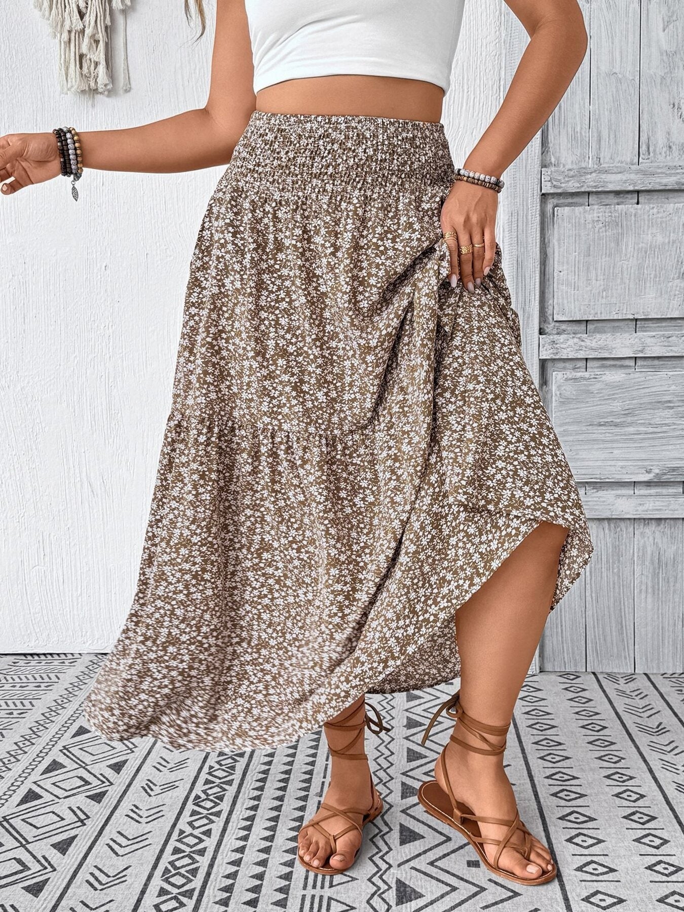 Tiered floral print midi skirt in mocha with smocked waist and airy fabric.