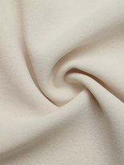 Beige tie-neck maternity overshirt fabric detail with subtle texture