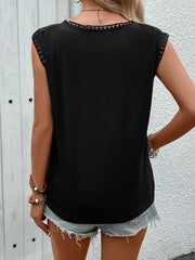 Black cap sleeve blouse with lace yoke and trim details