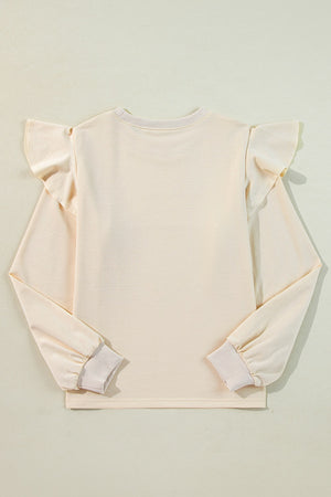 Cream ruffled shoulder sweatshirt with ribbed cuffs and crew neck.