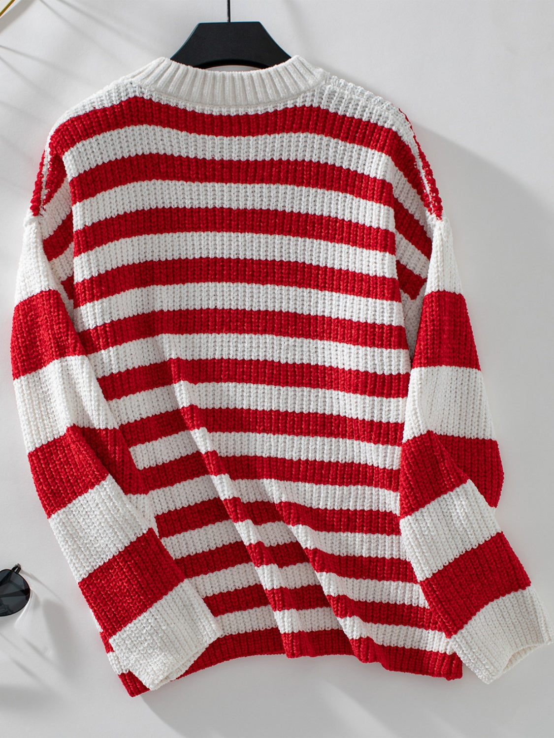 Bold stripe crewneck sweater in red and white knit with a relaxed fit.
