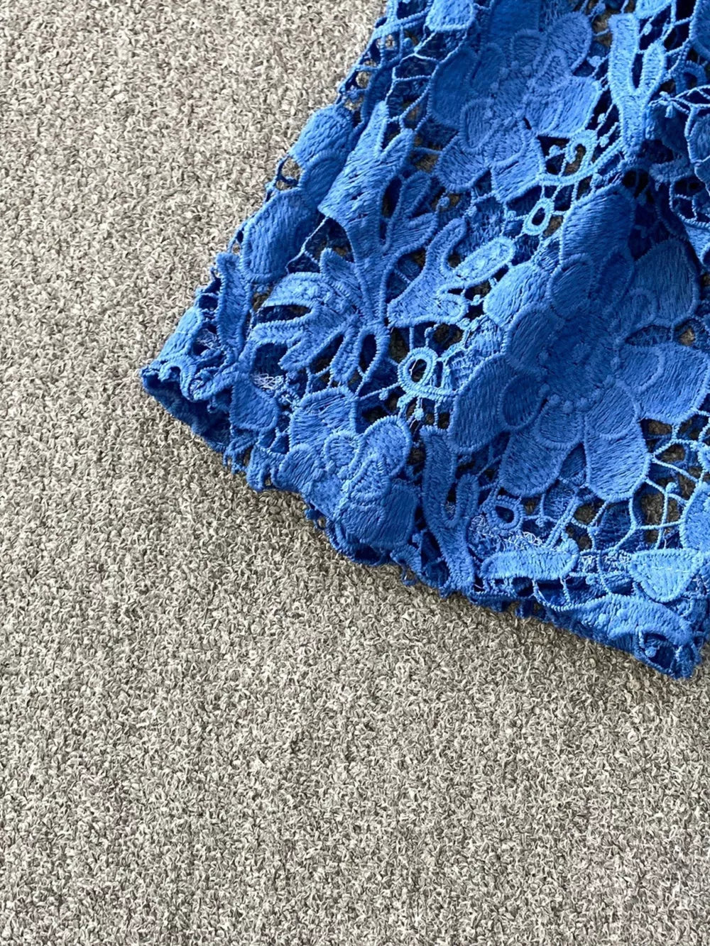Blue lace-embellished two-piece set with intricate floral cutouts.