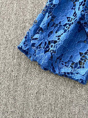 Blue lace-embellished two-piece set with intricate floral cutouts.