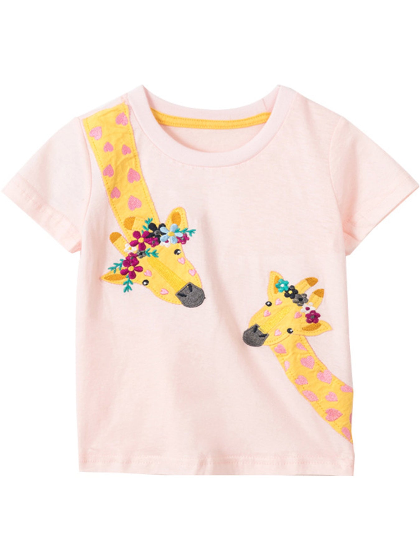 Pink cotton t-shirt with two embroidered giraffes wearing floral crowns and yellow patterned necks.