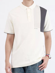 Men's cotton polo shirt with asymmetrical color-block detail on the chest and sleeves.