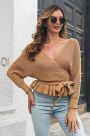 Camel ruffled wrap knit sweater with tie waist and open back.