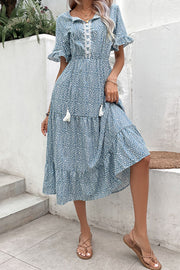 Light blue floral midi dress with tiered skirt, lace trim, and tassel details.