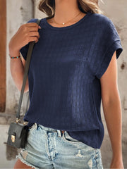 Navy woven texture cap-sleeve top with crew neck, styled with denim shorts.