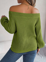 Moss green open-knit off-shoulder sweater with voluminous sleeves.