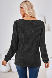 Puffed sleeve ribbed square neck top in black, shown from the back.