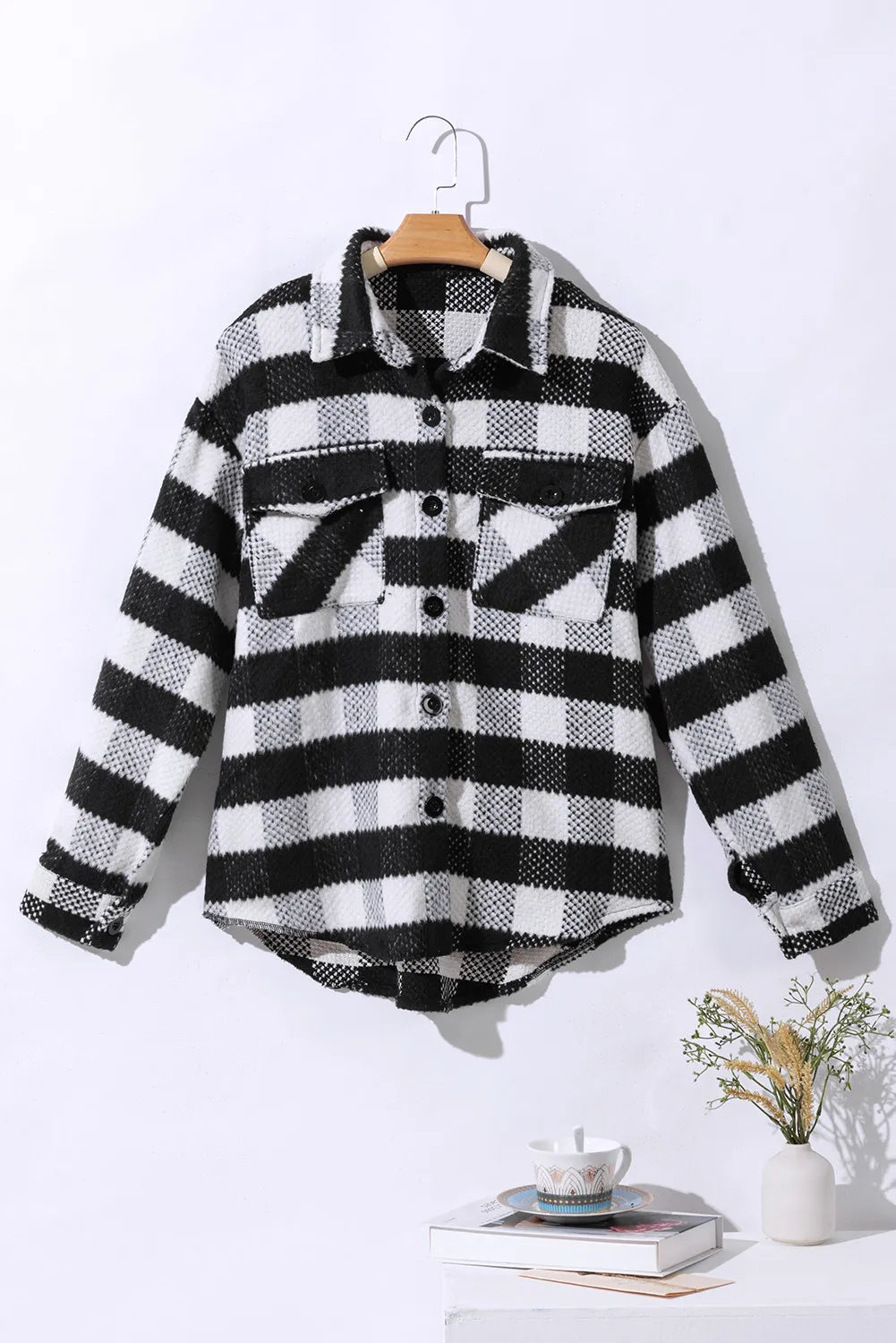 Textured checkerboard overshirt in plaid with button front and chest pockets.
