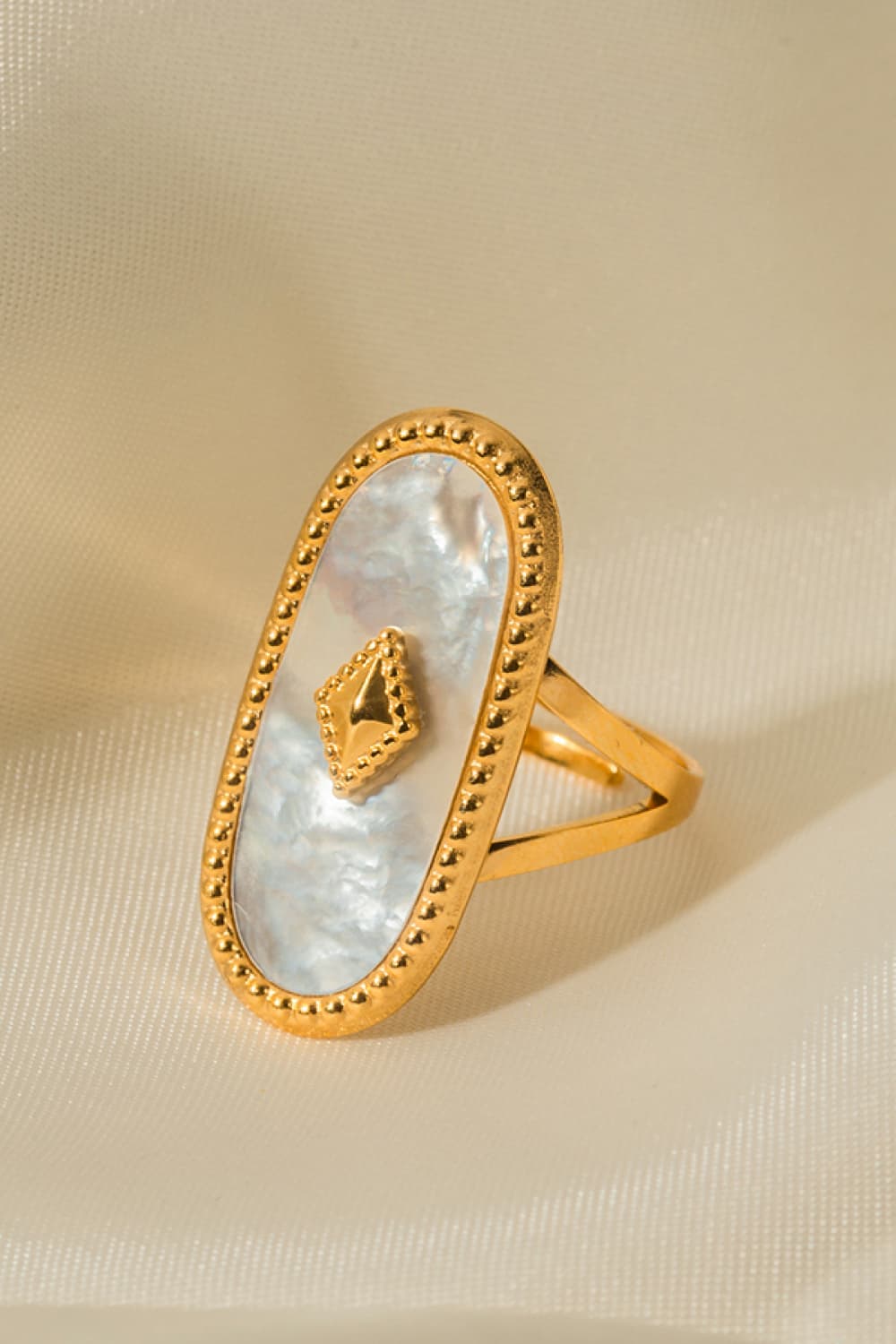 Gold-plated ring with white mother-of-pearl inlay and diamond accent