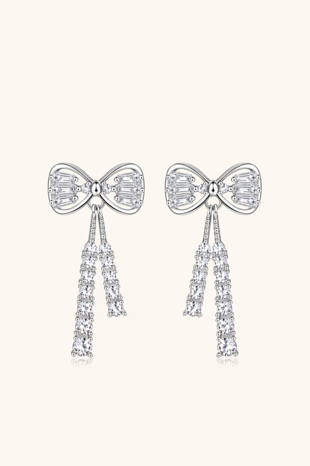 Silver bow drop earrings with baguette and round clear crystals